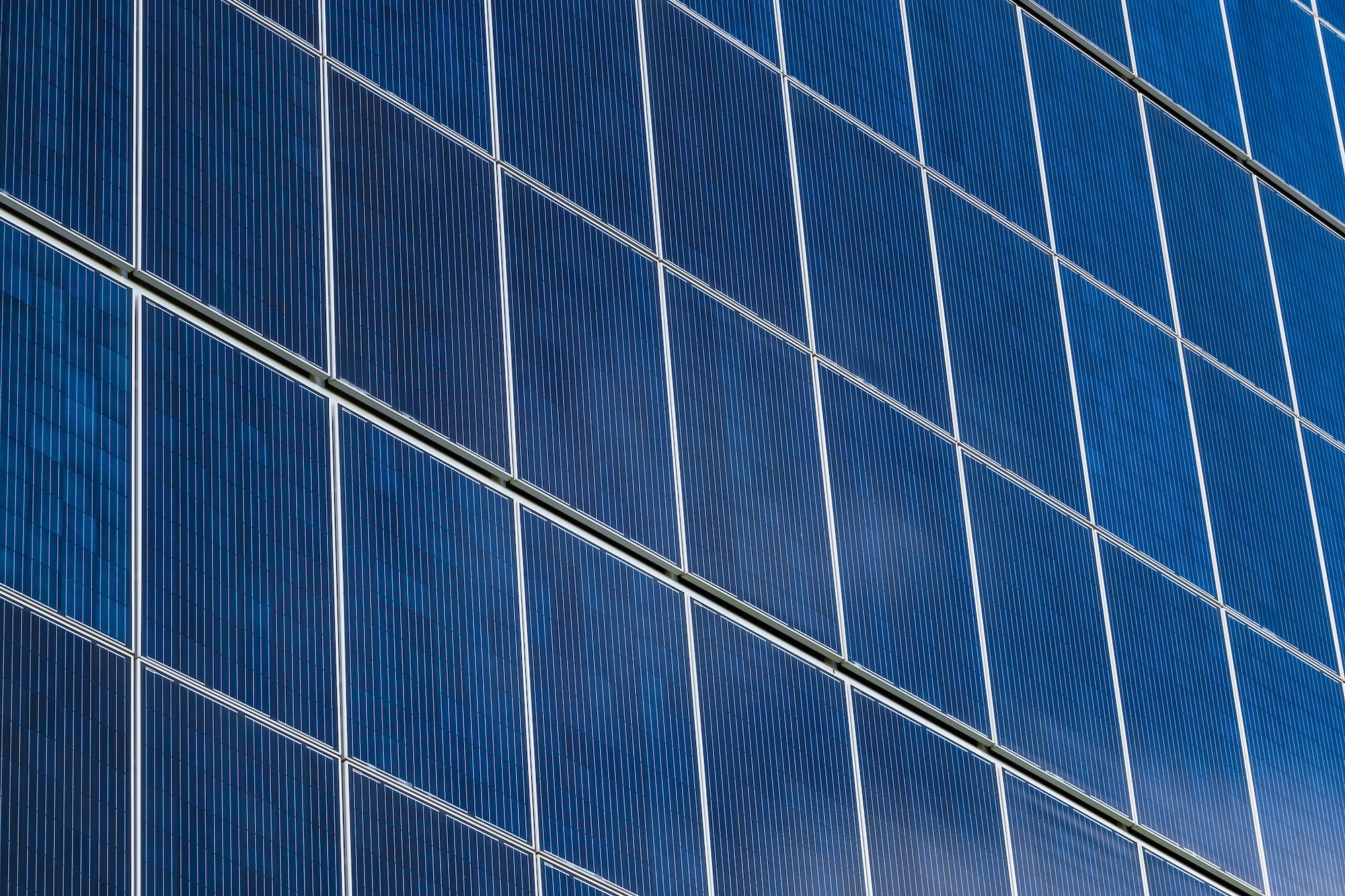 solar panels on the wall of a multi-storey building